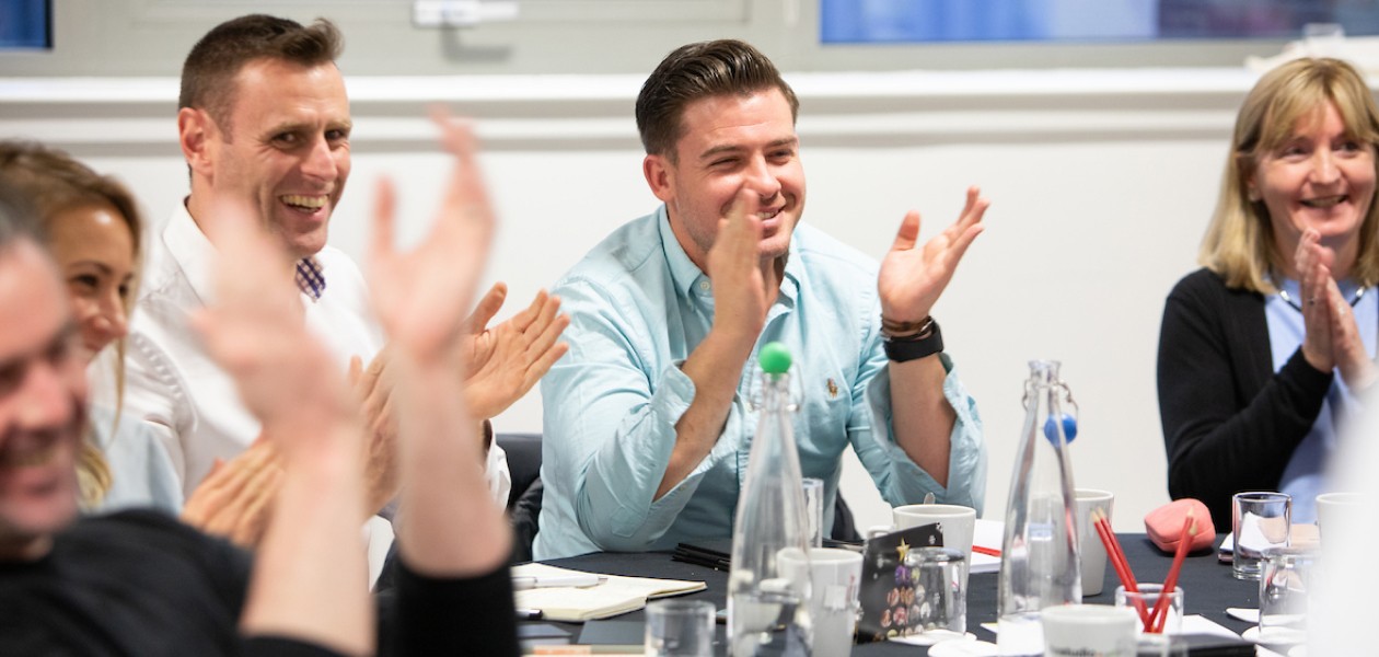 A group of people applauding